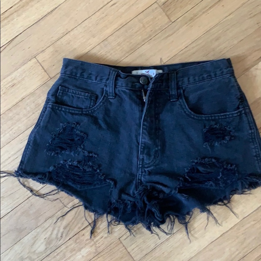 Short black shorts that are distressed